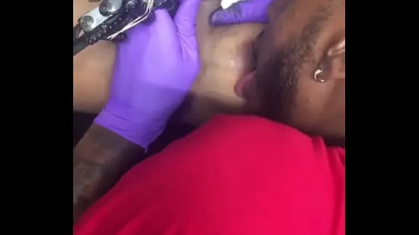 HD Horny tattoo artist multi-tasking sucking client's nipples energy Clips