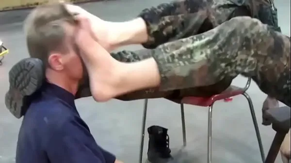 HD A lucky guy is allowed to lick the boots of two German soldiers คลิปพลังงาน